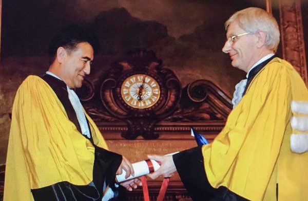 Tashpolat Tiyip (left) receives an honorary degree for his work on arid ecosystems ecology from the Sorbonne in Paris in November 2008. NURY TIYIP